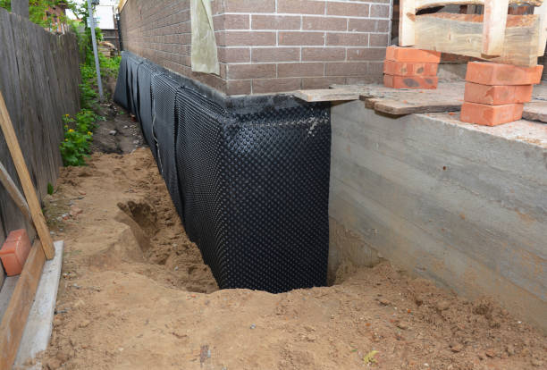 Happy homeowners after waterproofing job in Oconto